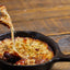 Provoleta Argentina / Provolone Cheese seasoned with alicante oregano in cast iron pan