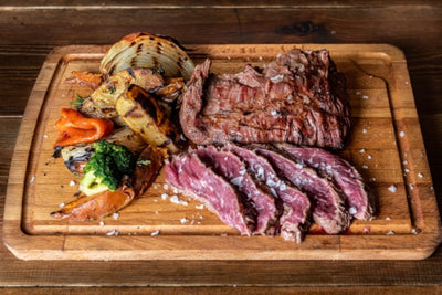 Celusal BBQ Iodized salt sprinkled on Argentine cut of meat called Vacio and vegetables.