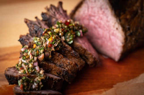 Sliced dteak with chimichurri made from Monte Cudine mojo parrillero