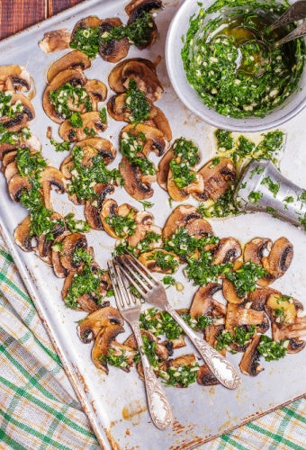 Baked mushrooms with chimichurri sauce, bowl of alicante chimichurri