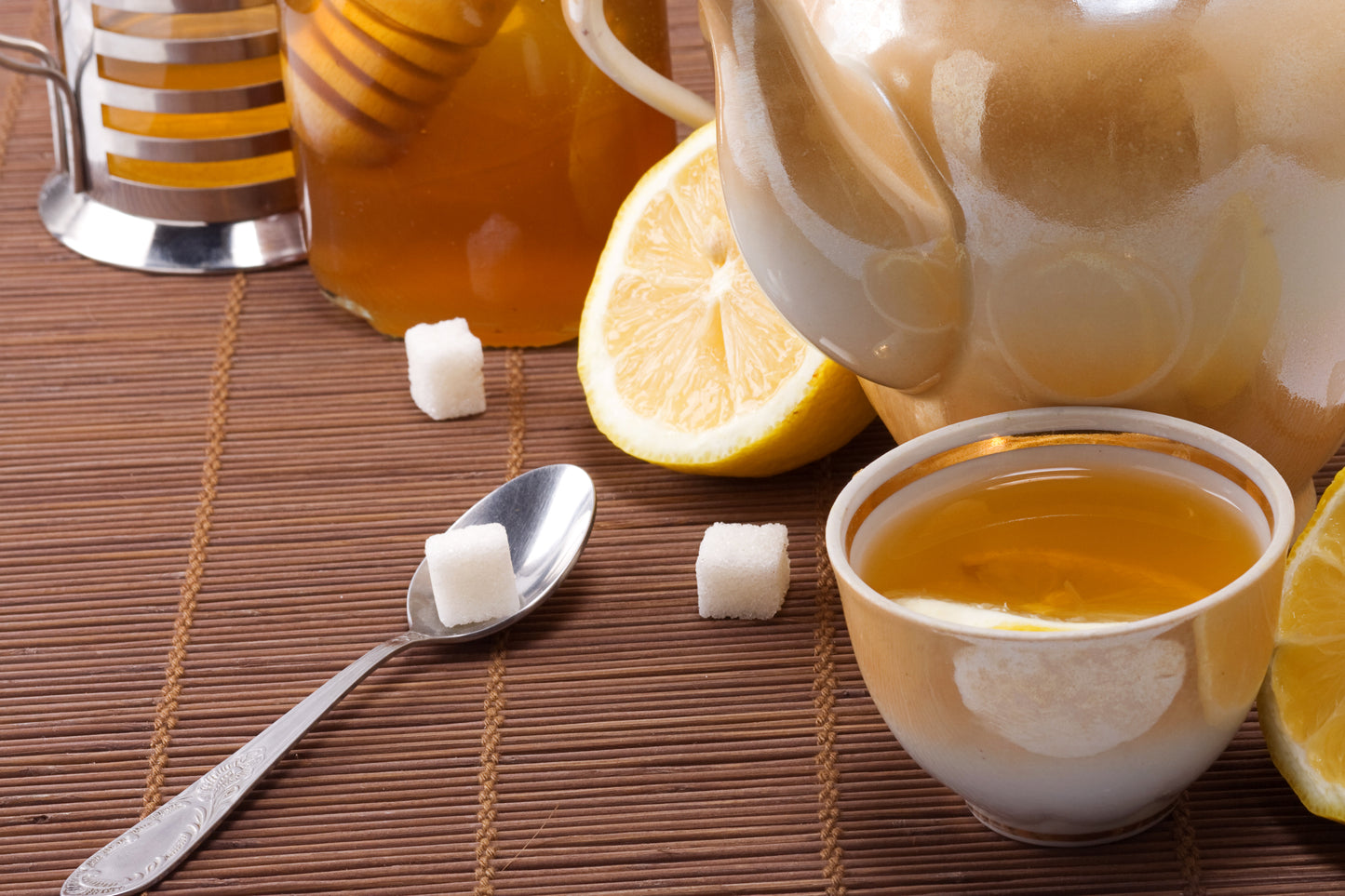 tea, pot and honey on table