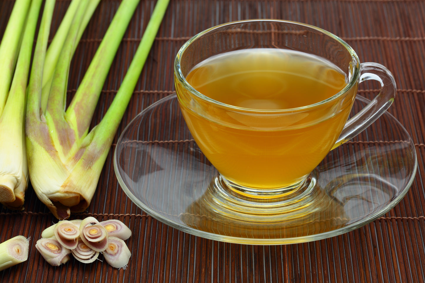 Glass cup of lemon grass tea and lemon grass.