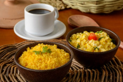 Café Aviacao Especial Coffee and corn couscous with egg in clay bowl.