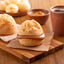 Brazilian snack. Pão de Queijo filled with dulce de leche. Cafe Melitta Tradicional Black coffee. Breakfast.