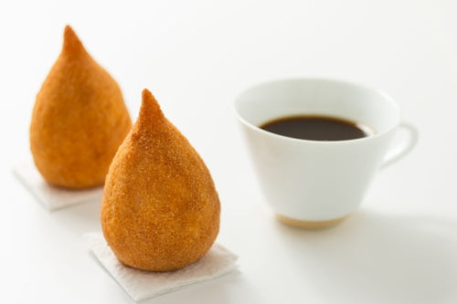 Brazilian Cafe Pilao Tradicional and Coxinha, a fried chicken finger food