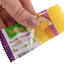 Hand holding open Dulzura coconut pineapple bocaditos snacks