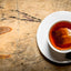 hot Cup of tea on wooden background.