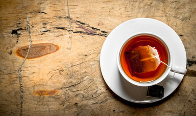 hot Cup of tea on wooden background.