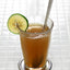 Glass of emolient with spoon and lime